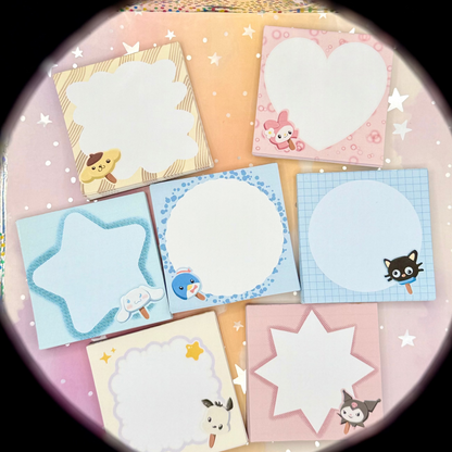 A set of pastel-colored notepad sheets with cute SANRIO characters and star patterns, arranged in a circular cluster on a pink glittery surface.